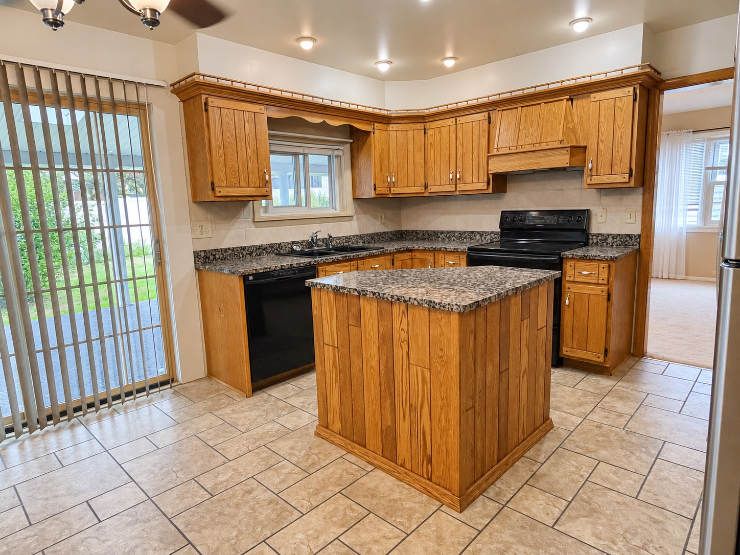 317 Chestnut Street — Kitchen with granite countertops and island