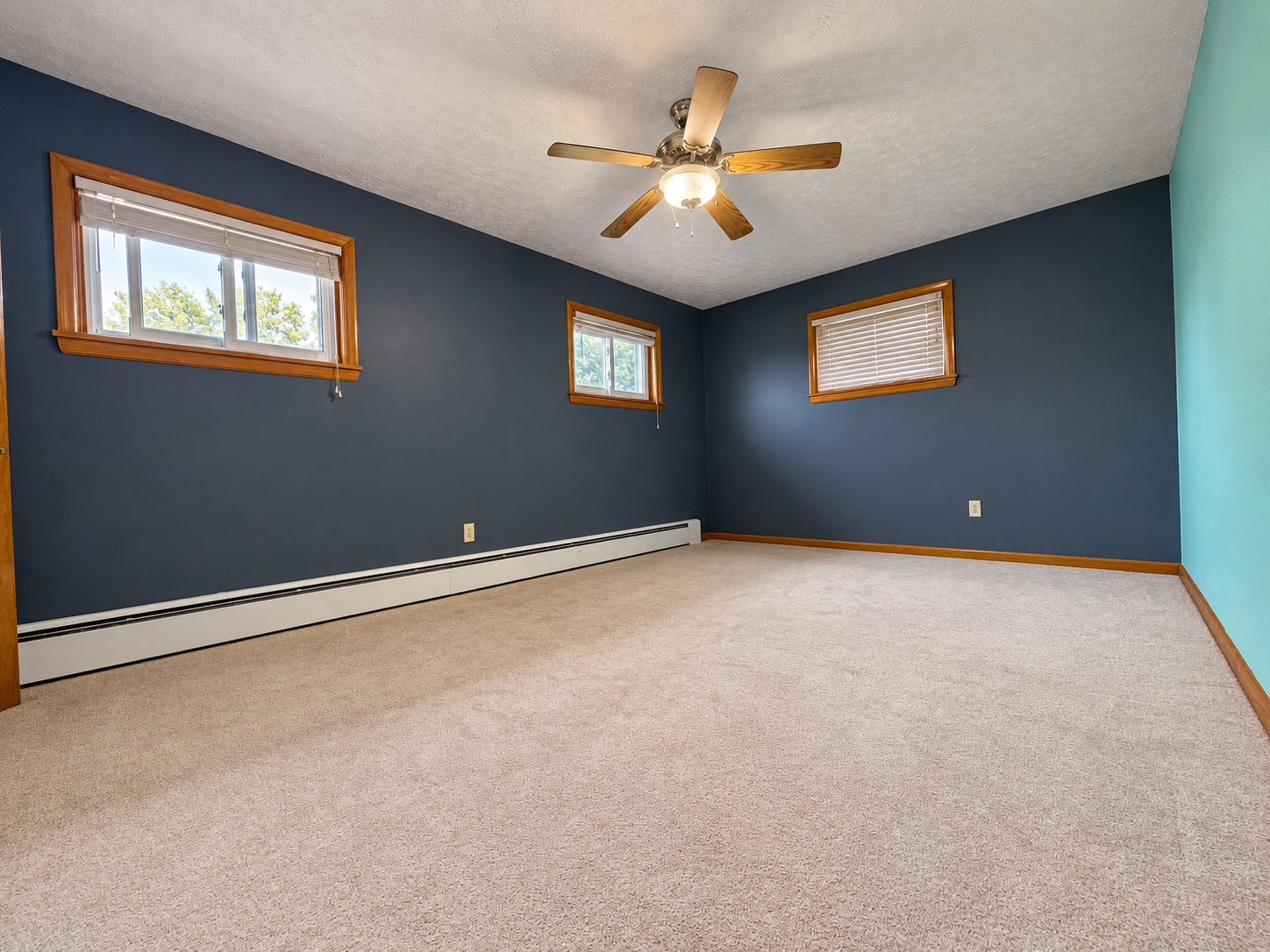 317 Chestnut Street — Blue bedroom with ceiling fan