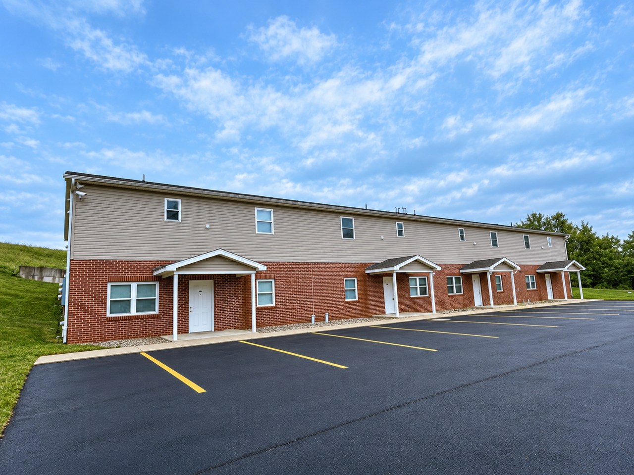 Exterior of the Strangford Road apartments with off-street parking